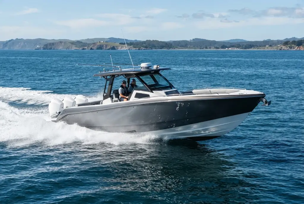 High-performance powerboat speeding across open water with a wide wake